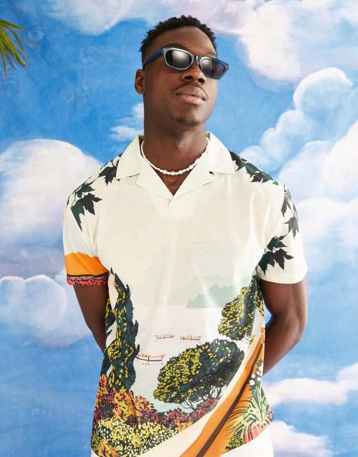 ASOS DESIGN - Ruimvallend poloshirt met reverskraag en bedekt met landschapsprint
