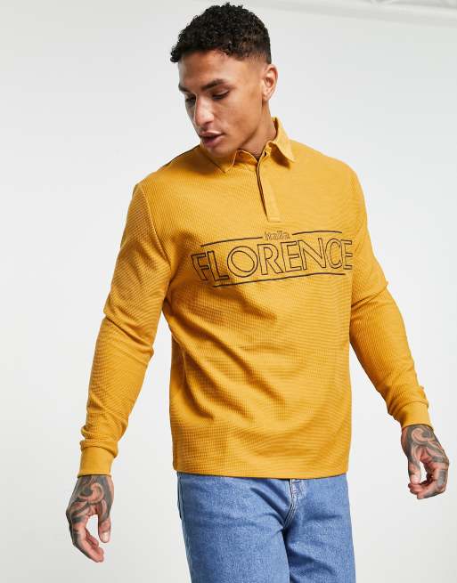 ASOS DESIGN - Ruimvallend poloshirt met textuur, lange mouwen en stadsprint in bruin 