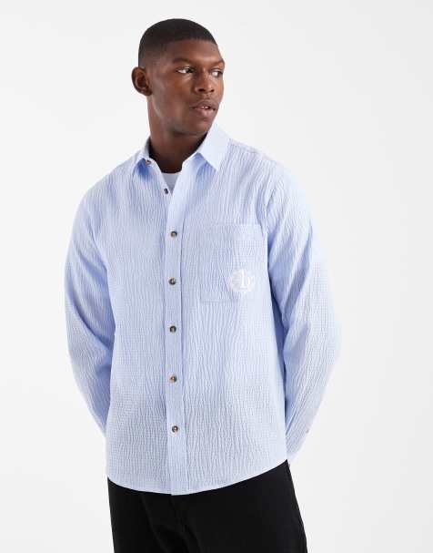 ASOS DESIGN - Ruimvallend seersucker overhemd met borduursel in blauw - view 1