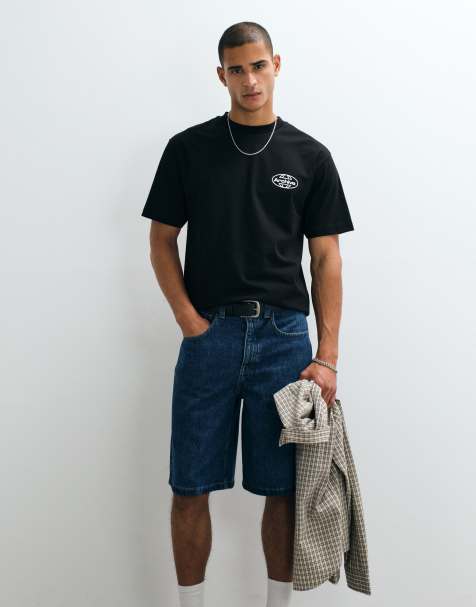 ASOS DESIGN - Ruimvallend T-shirt met bolle grafische Studios-tekstprint in zwart - view 1