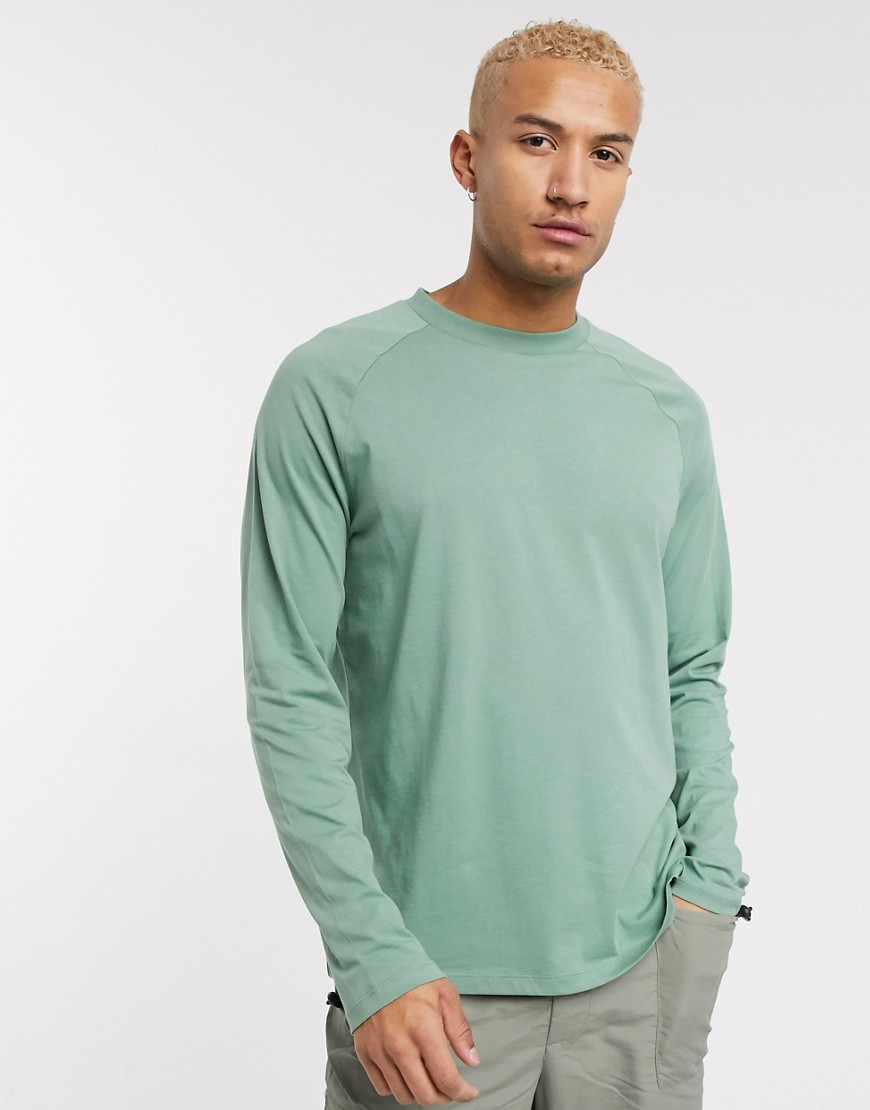 ASOS Design - Ruimvallend T-shirt met lange raglanmouwen met hoge hals in groen