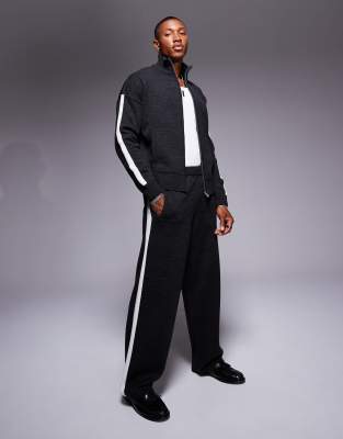 ASOS DESIGN - Ruimvallende gebreide joggingbroek met zijstreep in donkergrijs
