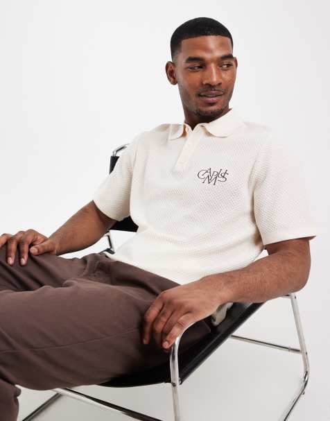 ASOS DESIGN - Ruimvallende gebreide polo met borduursel op de borst in ecru - view 1