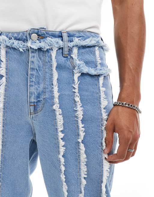 ASOS DESIGN - Ruimvallende jeans met gerafeld detail in lichte wassing blauw, 4 van 5