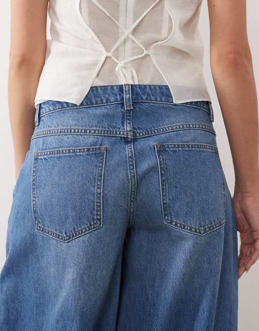 ASOS DESIGN - Ruimvallende jeans met lage taille in middenblauw, 4 van 5