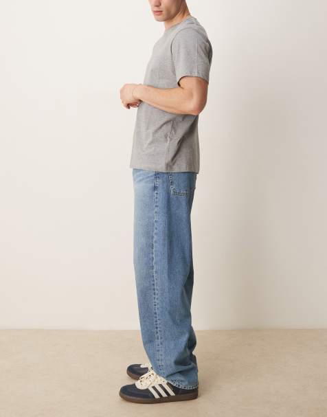 ASOS DESIGN - Ruimvallende jeans met middenblauwe wasing - view 1