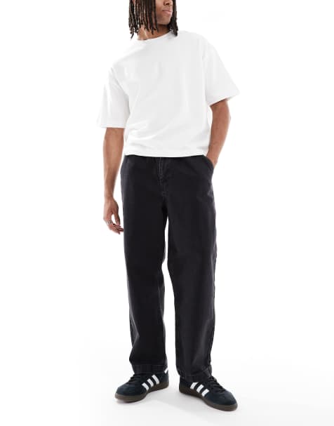 ASOS DESIGN - Ruimvallende jeans met smaltoelopende pijpen in zwart met wassing - view 1