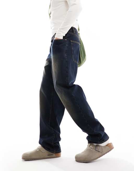 ASOS DESIGN - Ruimvallende jeans met tint in indigo