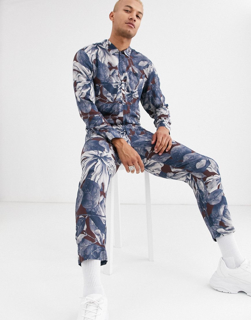 ASOS DESIGN - Ruimvallende jumpsuit met utility stijl in bloemenprint-Blauw