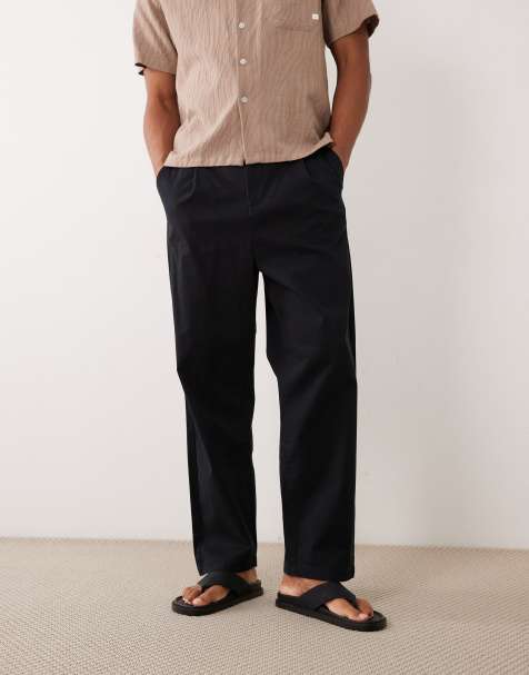 ASOS DESIGN - Ruimvallende toelopende chino in zwart - view 1