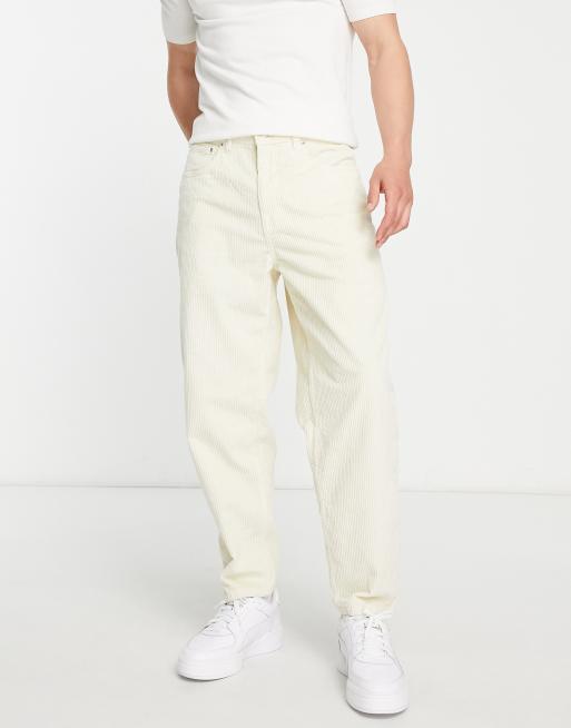 ASOS DESIGN - Ruimvallende, toelopende jeans van corduroy in ecru