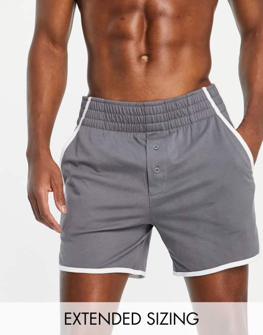 ASOS DESIGN runner shorts in dark grey with white binding