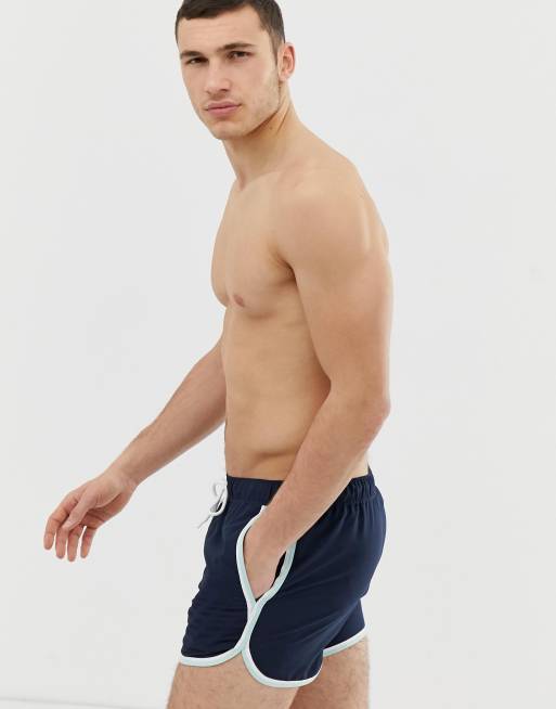 ASOS DESIGN runner swim shorts in navy with white binding