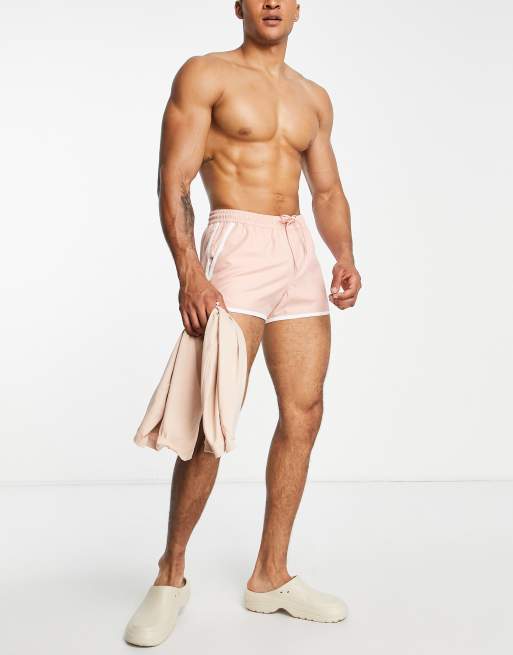 ASOS DESIGN runner swim shorts in super short length with contrast binding in pink