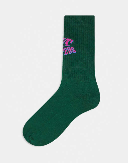 ASOS DESIGN s*** happens slogan socks in green