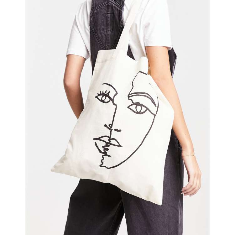 ASOS DESIGN Sac fourre tout en coton avec imprim visage