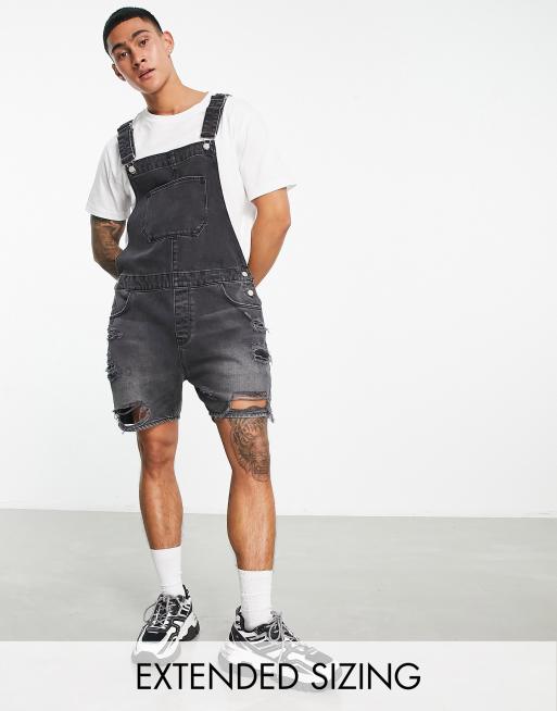 ASOS DESIGN - Salopette courte en jean avec déchirures prononcées - Noir délavé