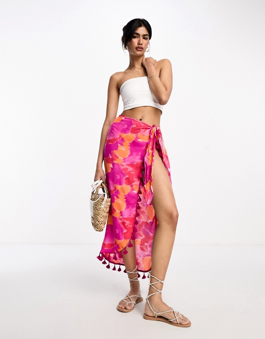 ASOS DESIGN sarong midi skirt in bright blurred floral with tassels-Multi
