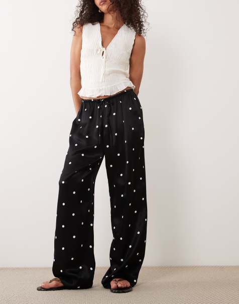 ASOS DESIGN - Satijnen broek met wijde pijpen, elastische taille en stippen in zwart - view 1