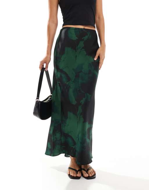 ASOS DESIGN satin bias cut midi skirt in green black blurred floral