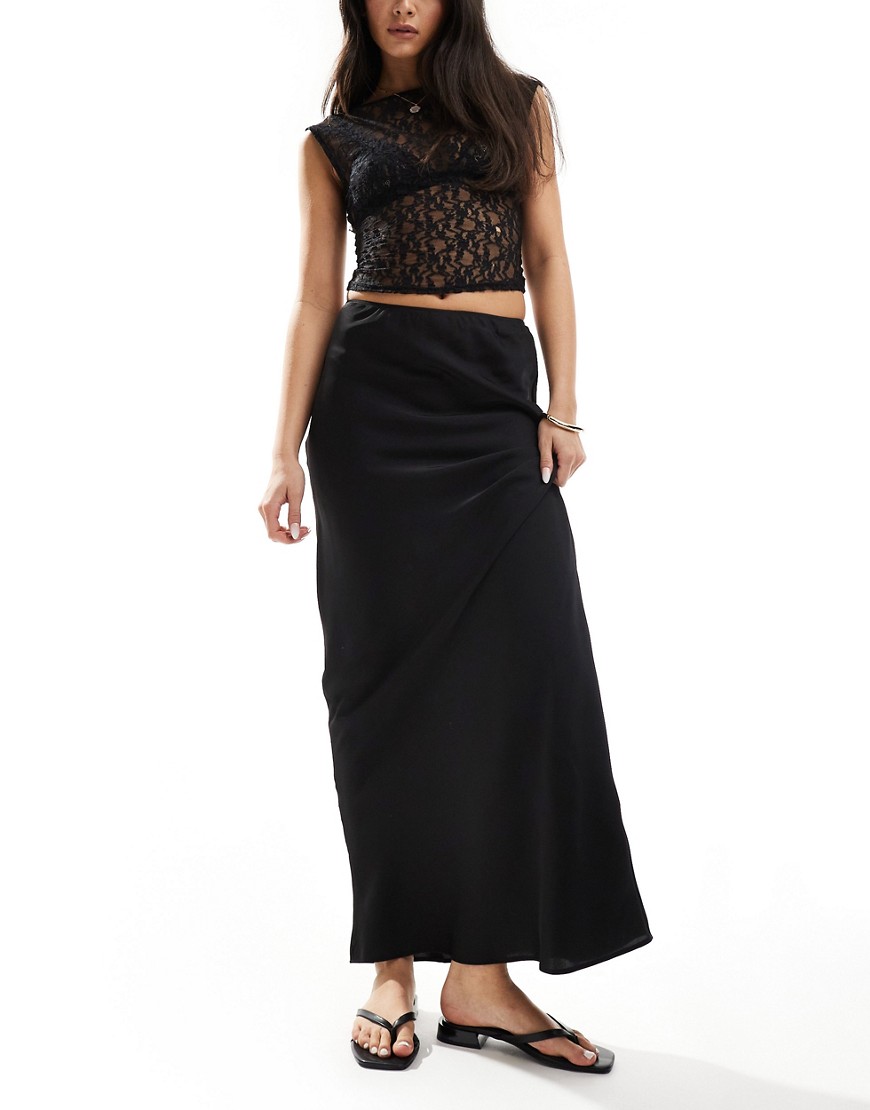 Shop Asos Design Satin Bias Maxi Skirt In Black