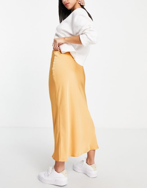 ASOS DESIGN satin bias midi skirt in gold