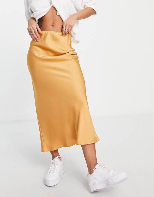 ASOS DESIGN satin bias midi skirt in gold