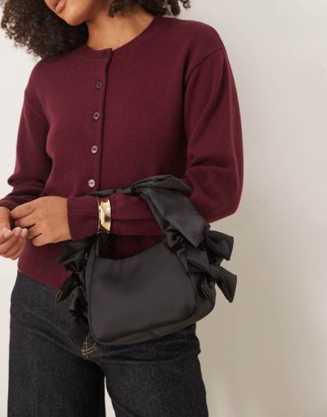 ASOS DESIGN – Satin-Clutch in Schwarz mit Henkel und Schleifendetail - view 1