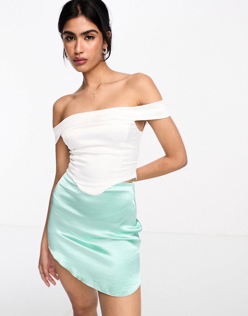 satin mini skirt with curved hem in mint green