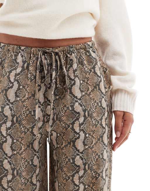 ASOS DESIGN satin pull on trouser in snake print
