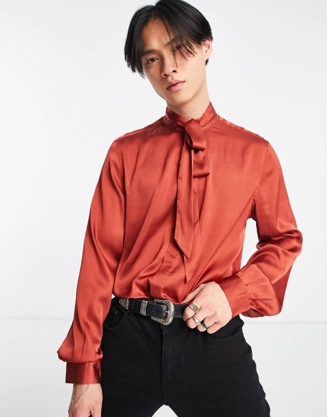 ASOS DESIGN satin shirt with tie neck and blouson volume sleeve in brick red