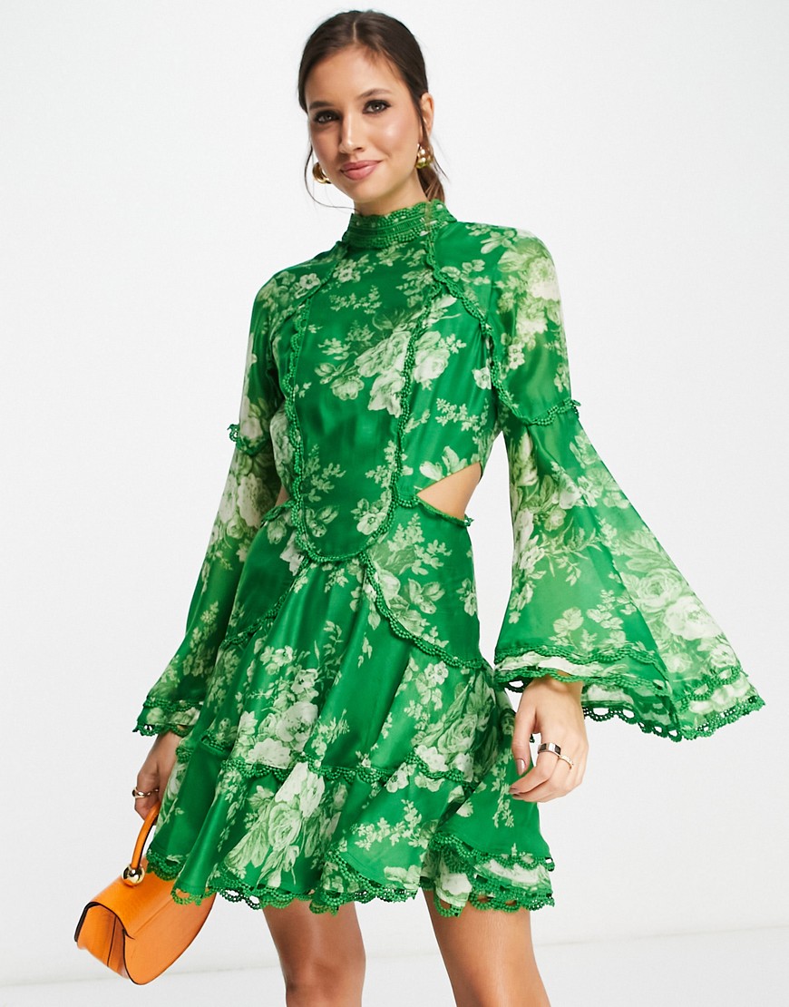 ASOS DESIGN scallop trim high neck mini dress with cut out waist detail with floral print in green