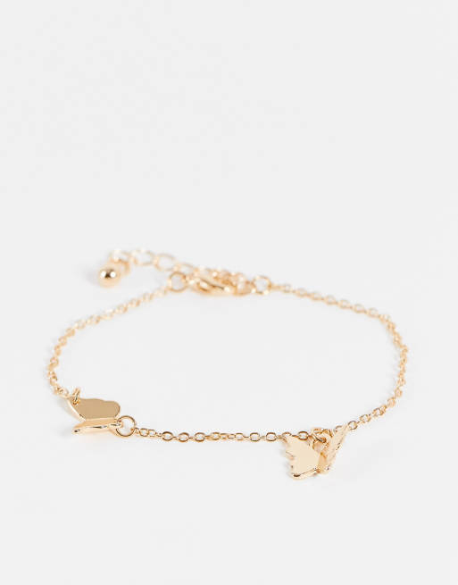 ASOS DESIGN - Schakelarmband met delicate vlinder-bedeltjes in goudkleur