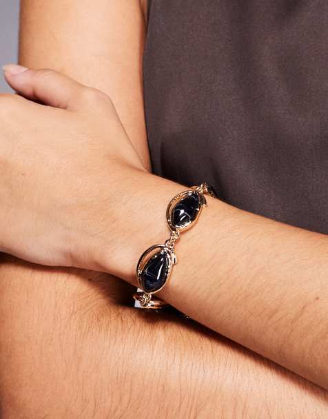 ASOS DESIGN - Schakelarmband met marineblauwe imitatie-halfedelstenen in goudkleur - view 1