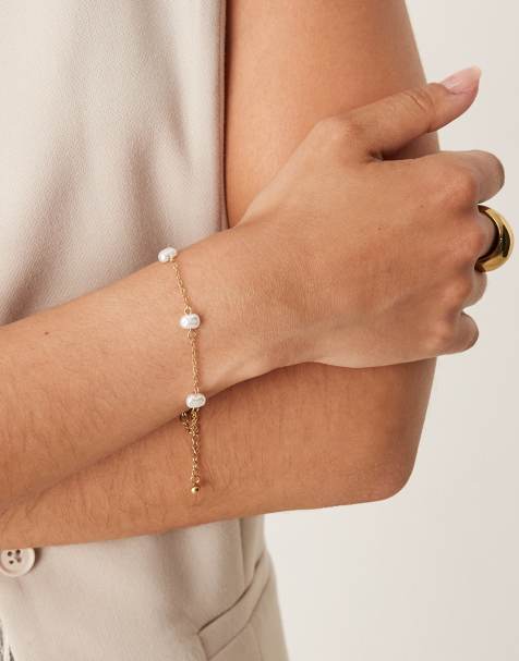 ASOS DESIGN - Schakelarmband van waterbestendig roestvrij staal met kleine imitatieparels in goudkleur - view 1