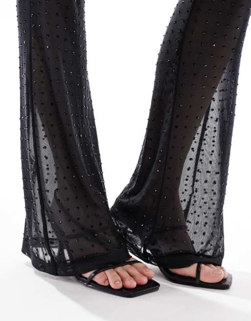 ASOS DESIGN – Schlaghose aus transparentem Netzstoff in Schwarz mit Hotfix-Verzierung, 4 von 5