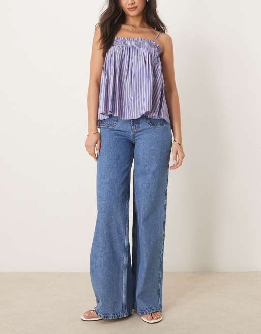 ASOS DESIGN – Schlichte Jeans in Mittelblau mit weitem Schnitt und Vordertaschen