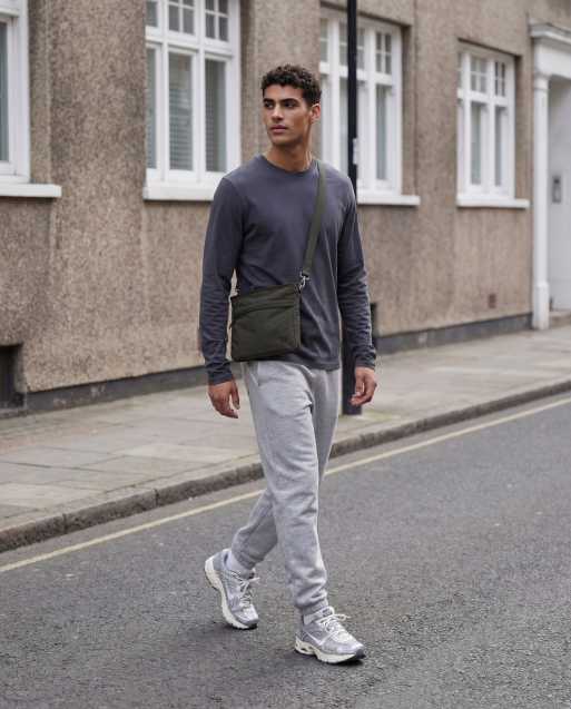 ASOS DESIGN – Schmal geschnittene Basic-Jogginghose in meliertem Grau , 11 von 12