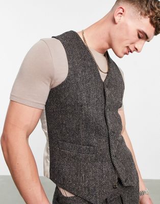 ASOS DESIGN – Schmal geschnittene Harris-Tweed-Anzugweste in Braun mit Fischgrätmuster aus 100% Wolle.