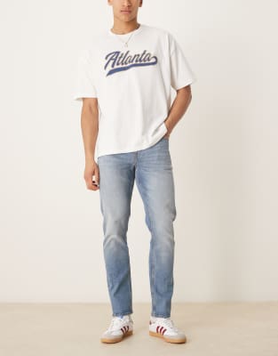 Schmal geschnittene Jeans in mittelblauer Vintage-Waschung Blau 50 Long