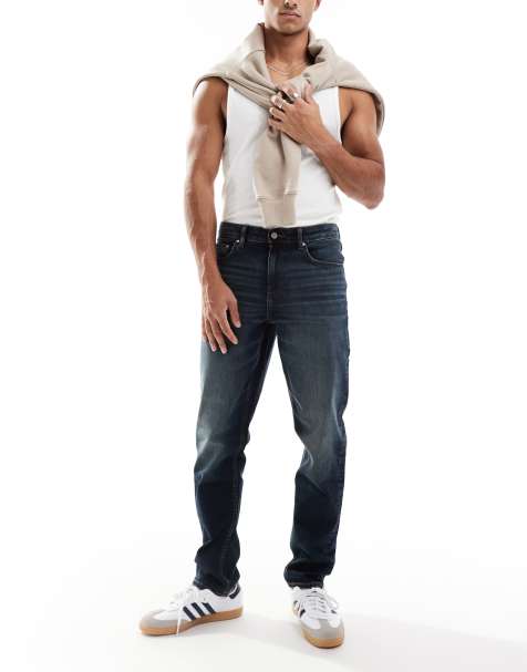 ASOS DESIGN – Schmal geschnittene Jeans in verwaschener, dunkelblauer Tönung - view 1