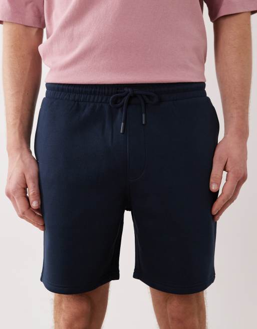 ASOS DESIGN – Schmal geschnittene, mittellange Basic-Shorts aus Jersey in Marineblau, 4 von 5