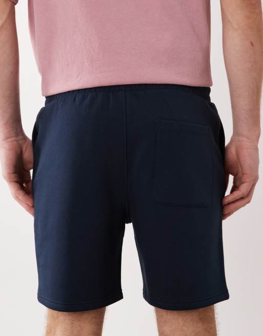 ASOS DESIGN – Schmal geschnittene, mittellange Basic-Shorts aus Jersey in Marineblau, 5 von 5