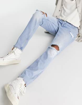 bleached indigo ripped tapered denim jeans