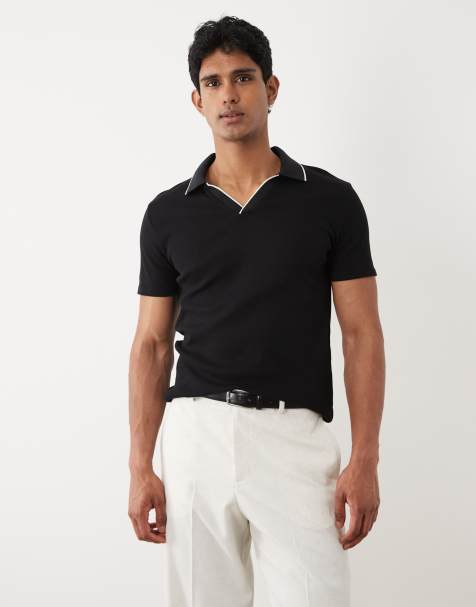 ASOS DESIGN – Schmal geschnittenes, geripptes Polohemd in Schwarz mit Kontrasteinfassung - view 1
