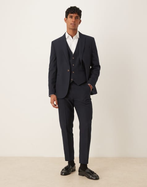 ASOS DESIGN – Schmal zulaufende Anzughose in marineblauer Wolloptik mit Fischgrätmuster - view 1