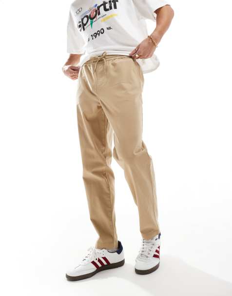 ASOS DESIGN – Schmal zulaufende Chino-Schlupfhose in Beige mit elastischem Bund - view 1