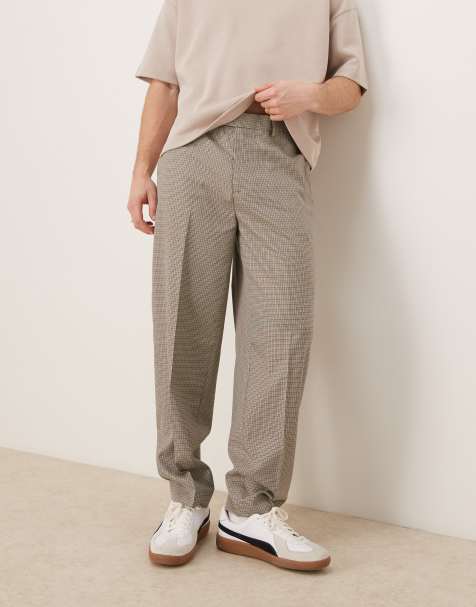 ASOS DESIGN – Schmal zulaufende, elegante Oversize-Hose mit kleinem Karomuster in Braun - view 1