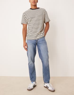 Schmal zulaufende Jeans in mittelblauer Waschung Blau 47 Regular