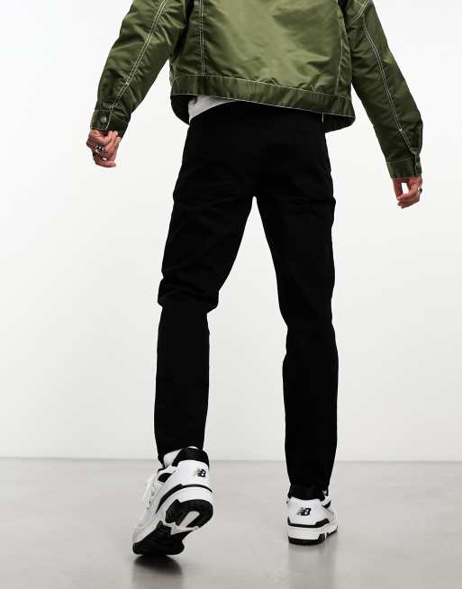 ASOS DESIGN – Schmal zulaufende Jeans in No-Fade-Schwarz, 2 von 4